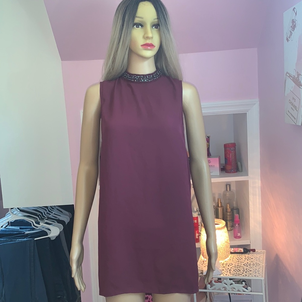 Plum tunic with jeweled neck
